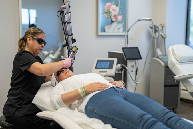 Woman receiving a facial treatment